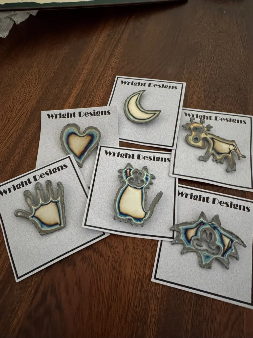 Brooches. Each piece is handcrafted. individually cut out of chrome plated steel
